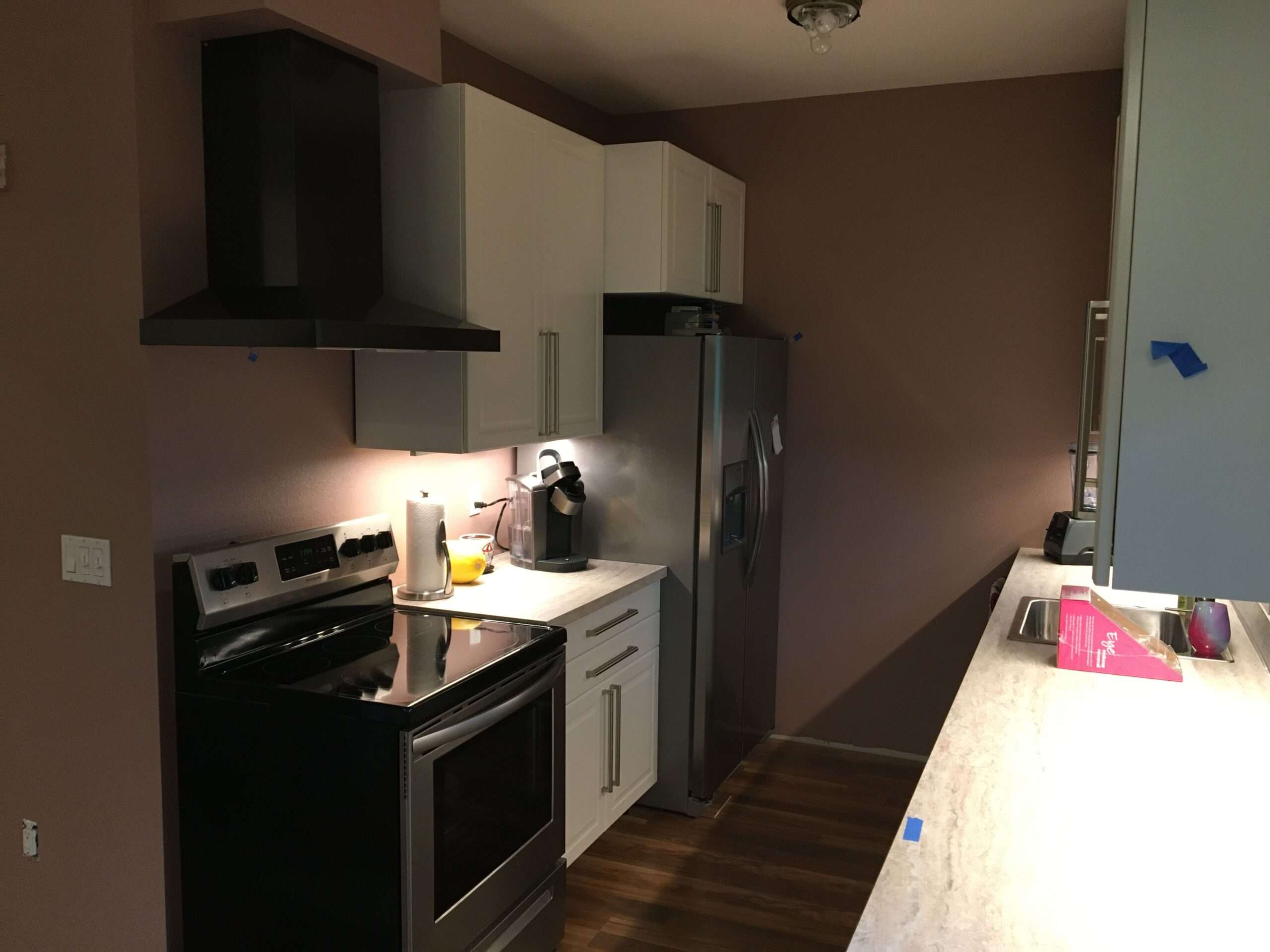 Modern kitchen interior with appliances and white cabinets